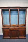A REPRODUCTION MAHOGANY BREAKFRONT BOOKCASE, the open triple section top with a blue painted