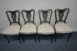 A SET OF FOUR MAHOGANY DINING CHAIRS, with foliate splat backs, raised on front cabriole legs (