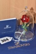 A SWAROVSKI CRYSTAL 'ENCHANTED ROSE' from Disney's 'Beauty and the Beast,' with glass dome, numbered