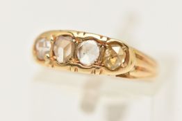 A YELLOW METAL DIAMOND RING, set with four rose cut diamonds (one tinted yellow), each in a claw/