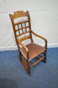 AN EARLY 20TH CENTURY ELM ROCKING CHAIR, with brown leatherette seat, width 51cm x depth 69cm x