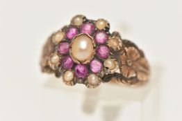A YELLOW METAL RUBY AND SPLIT PEARL CLUSTER RING, of an oval form set with a central split pearl