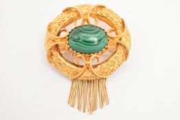A YELLOW METAL VICTORIAN MALACHITE SET BROOCH, of an open work form, set to the centre with a