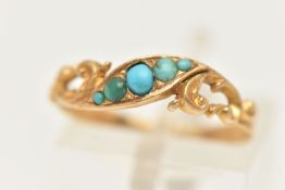 A YELLOW METAL TURQUOISE RING, set with a row of five small turquoise cabochons, to the scrolling