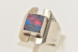 A SILVER GEM SET RING, a silver modernist design ring, collet set with an opal doublet,