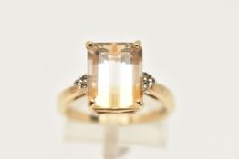 A 9CT GEM RING, designed as a rectangular gem, possibly tourmaline, with colourless gem detail to