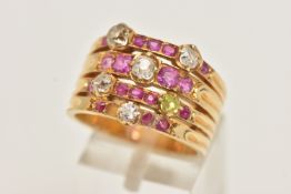 A GEM SET DRESS RING, a yellow metal ring designed as four bands set with four mixed cut rubies