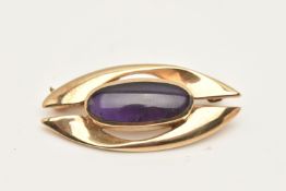 A 9CT GOLD AMETHYST BROOCH, designed as a central oval amethyst within a collet setting, to the