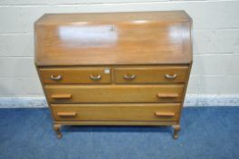 A 20TH CENTURY MAHOGANY BUREAU, the fall front door enclosing a fitted interior, above two short,