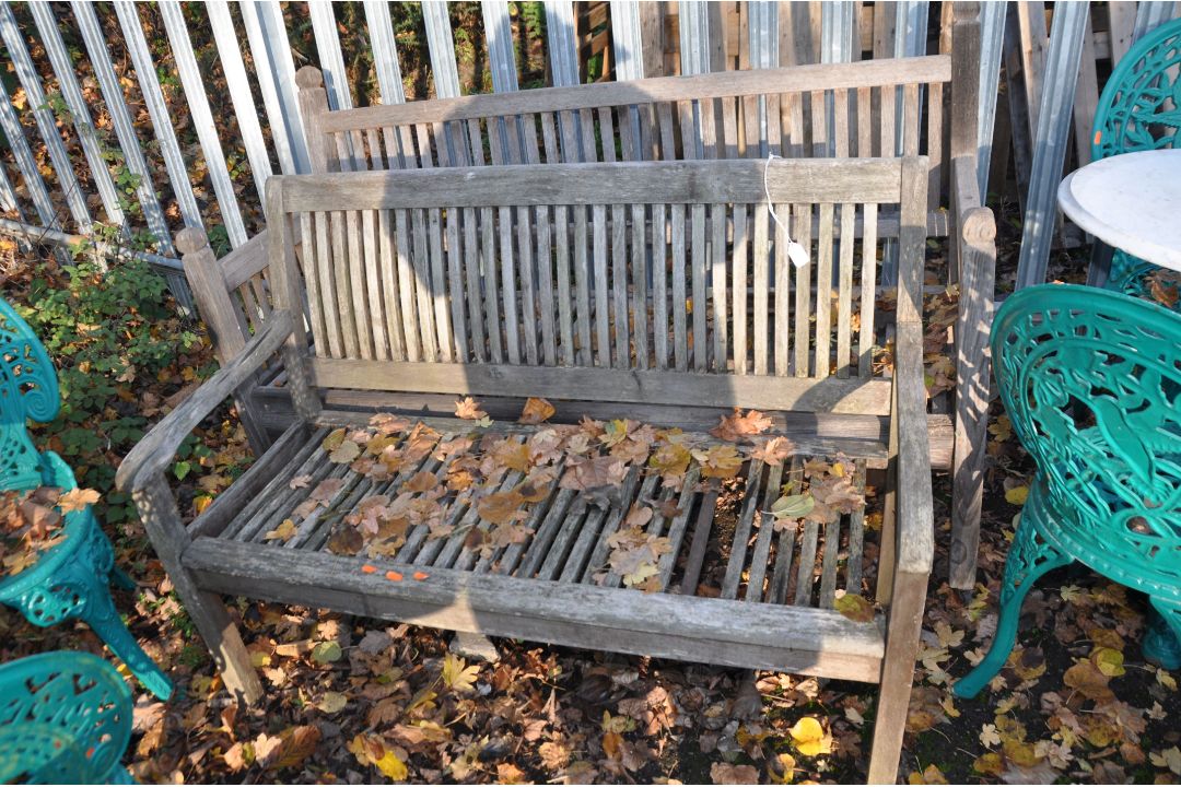 TWO MODERN WEATHERED HARDWOOD GARDEN BENCHES, both with slatted seats and backs, one 120cm wide, the - Image 1 of 4