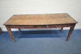 AN EARLY 20TH CENTURY OAK DESK, with a sloped top, two frieze drawers, raised on square tapered