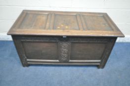A GEORGIAN PANELLED OAK BLANKET CHEST, with a foliate carved front, width 120cm x depth 57cm x