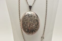 A SILVER LOCKET AND CHAIN, the oval locket with engraved floral and foliate decoration, suspended