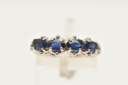 A 9CT WHITE GOLD SAPPHIRE RING, designed as a line of four oval claw set sapphires, 9ct hallmark,