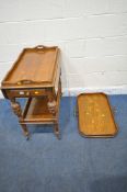 A 20TH CENTURY OAK DROP LEAF TIER TROLLEY, with twin handles to the top, a single frieze drawer,
