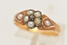 A YELLOW METAL SPLIT PEARL AND DIAMOND MEMORIAL RING, designed as a flower set with a very small