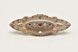 A VICTORIAN GEM SET BROOCH, the elongated design centrally set with a line of garnet topped doublets