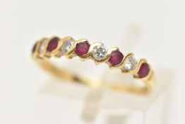 AN 18CT GOLD RUBY AND DIAMOND HALF ETERNITY RING, set with a row of five circular cut rubies