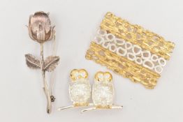 THREE BROOCHES, the first a silver brooch designed as two owls, with gold plated detail,
