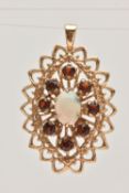 A 9CT GOLD OPAL AND GARNET SET PENDANT, of a lozenge open work shape, set with a central oval cut