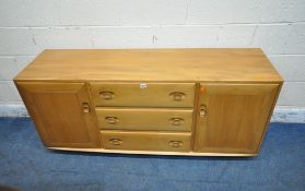 LUCIAN ERCOLANI, AN ERCOL MID CENTURY ELM SIDEBOARD, fitted with two cupboard doors, flanking