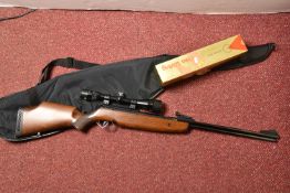 A BSA .22 AIR RIFLE SERIAL NO.RH11170, fitted with a Nikko Stirling Gold Crown Waterproof 4-12x40
