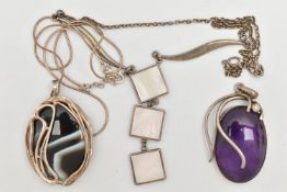 THREE ITEMS OF JEWELLERY, to include a large oval amethyst cabochon set pendant, collet set in a