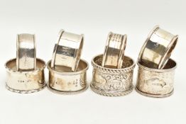 AN ASSORTMENT OF SILVER NAPKIN RINGS, eight silver napkins all with varying designs, four hallmarked