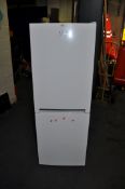 A BEKO CRFG1552W FRIDGE FREEZER, width 55cm, depth 55cm, height 152cm (PAT pass and working at 3 and
