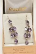 A PAIR OF GEM SET EARRINGS, chandelier style white metal drop earrings, each prong set with six oval