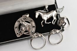 FIVE WHITE METAL JEWELLERY ITEMS, to include a horse shoe and head pendant, a running horse pendant,