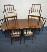 A 20TH CENTURY MAHOGANY OVAL EXTENDING DINING TABLE, with one additional leaf, raised on turned