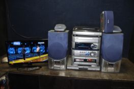 A LG 24TK410V 24in TV WITH REMOTE, an Aiwa Z-HT540 hi fi with five speakers (woofers from both