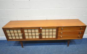 HERBERT GIBBS FOR YOUNGER, A MID CENTURY TEAK SIDEBOARD, fitted with three cupboard doors, and three