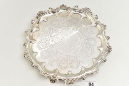 A VICTORIAN SILVER PRESENTATION SALVER, circular form salver with scrolling detail to the rim,