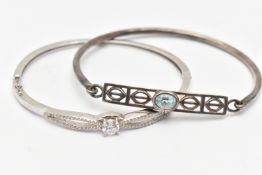 TWO WHITE METAL BANGLES, the first a white metal hinged bangle set with cubic zirconia, the second a