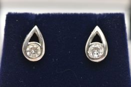 A PAIR OF 18CT WHITE GOLD DIAMOND EARRINGS, each of a pear drop open work design set with a round