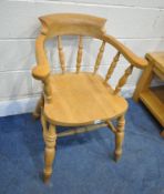 A LATE 20TH CENTURY BEECH BOW TOP SMOKERS CHAIR, the swept armrests with turned supports, raised