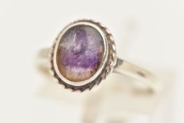 A WHITE METAL BLUE JOHN RING, oval cabochon collet set in white metal with rope twist detail