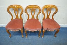 A SET OF THREE VICTORIAN CHAIRS, with shaped backrest, pink upholstery, raised on cabriole front