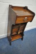 A 20TH CENTURY OAK CABINET, with a single drawer, above double cupboard doors, shaped front legs,