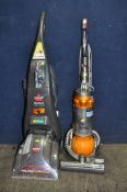 A DYSON DC25 UPRIGHT BALL VACUUM CLEANER and a Bissell Pro Heat carpet cleaner (both PAT pass and