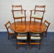 A LATE 20TH CENTURY OVAL DINING TABLE, with one additional leaf, both sections with a tilt top,