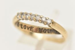 A 9CT GOLD DIAMOND 'I LOVE YOU' RING, set with a row of seven round brilliant cut diamonds, shared