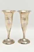 A PAIR OF EARLY 20TH CENTURY SILVER POSY VASES, tapering form with hammer effect, on round