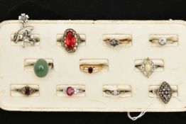 AN ASSORTMENT OF ELEVEN RINGS, to include a white and yellow metal ring with Portuguese Porto