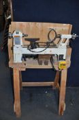 AN AXMINSTER M330 WOODTURNING LATHE ON A BESPOKE WOODEN STAND, with 33cm centre bed length (PAT pass