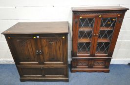 A JAYCEE OAK DOUBLE DOOR TV CABINET, with a fall front door, width 94cm x depth 54cm x height 104cm,