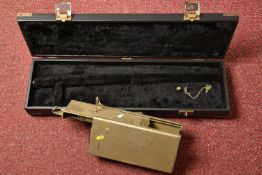 A BLACK EBONISED SHOTGUN CASE AND A GUNMATE GUN KEEP, with brass banding and a furry padded