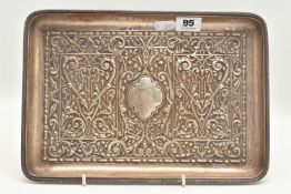 AN EARLY 20TH CENTURY SILVER EMBOSSED TRAY, of a rectangular form with embossed design, vacant